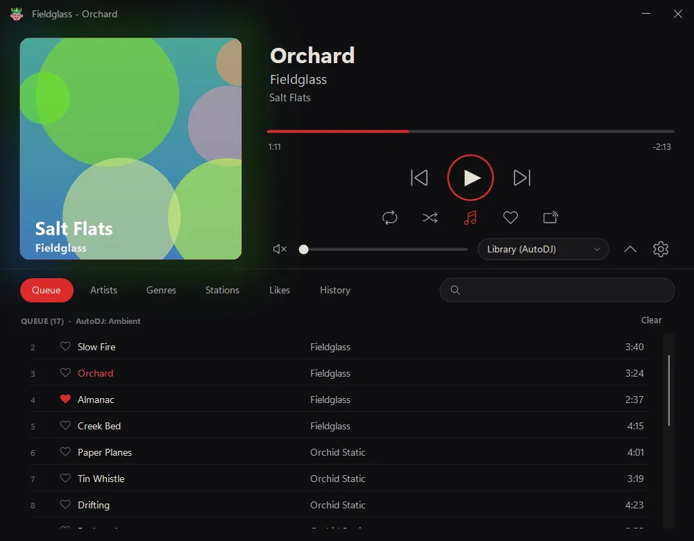 The Space Station desktop player showing a cover, transport controls and a queue of tracks